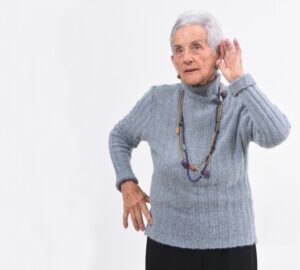 senior-woman-listening-with-hand-to-ear