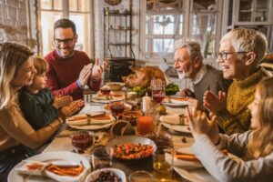 multigenerational-family-around-table-at-thanksgiving